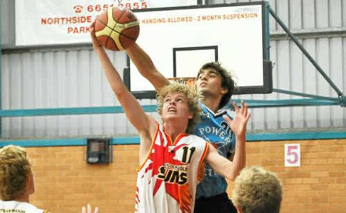 Coffs Harbour’s Blake Kelly rises for a rebound in the youth league. Coffs Harbour’s Blake Kelly rises for a rebound in the youth league.